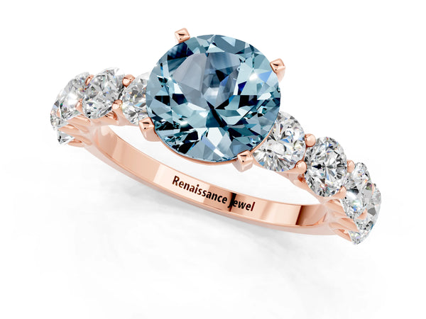 Rose gold Round Cut Aquamarine Prong Setting with Side Stones on a Pave Band