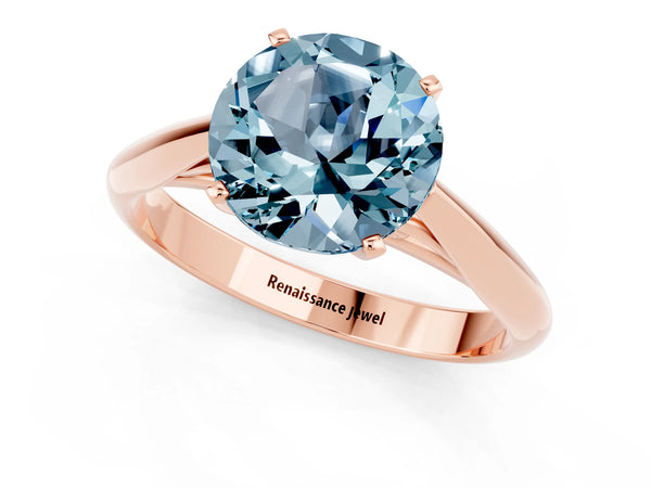 Rose gold Round Cut Aquamarine Solitaire Engagement Ring with Cathedral Setting and Four-Prong Mount