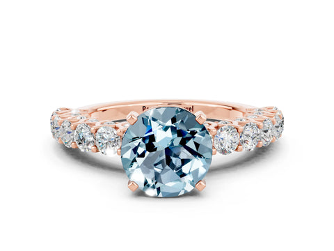 Rose gold Round Cut Aquamarine Solitaire Ring with Shared Prong Pavé Band and Four-Prong Setting
