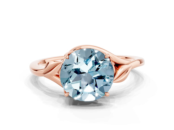 Rose gold Round Cut Aquamarine Solitaire Ring with Twist Band and Four-Prong Setting