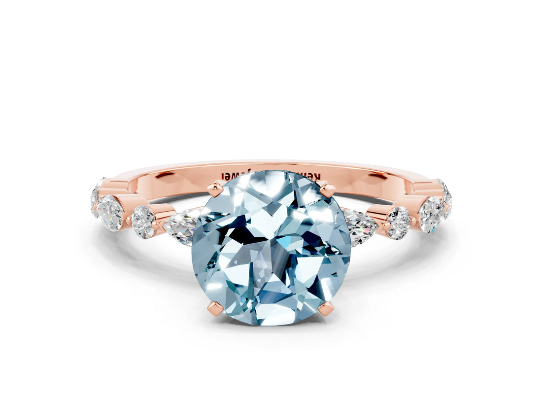 Rose gold Round Cut Aquamarine Solitaire with Side Stones on a Pavé Band and Four-Prong Setting