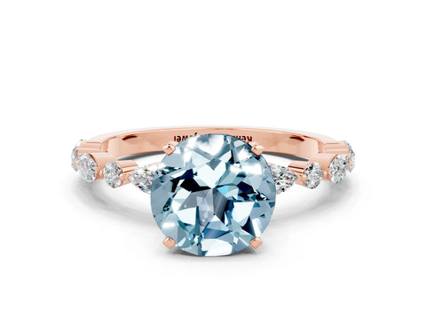 Rose gold Round Cut Aquamarine Solitaire with Side Stones on a Pavé Band and Four-Prong Setting