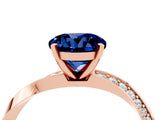 Rose gold Round Cut Blue Sapphire Engagement Ring with Side Stone Accents and Four-Prong Setting_31