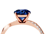 Rose gold Round Cut Blue Sapphire Engagement Ring with Side Stone Accents and Four-Prong Setting_64