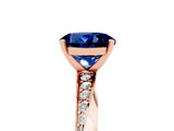 Rose gold Round Cut Blue Sapphire Engagement Ring with Side Stone Accents and Four-Prong Setting_65