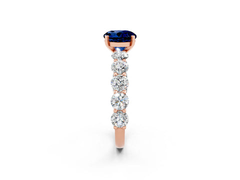 Rose gold Round Cut Blue Sapphire Prong Setting with Side Stones on a Pave Band_2