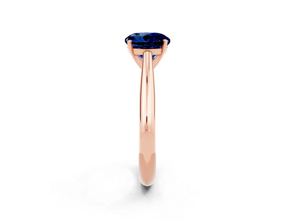 Rose gold Round Cut Blue Sapphire Solitaire Engagement Ring with Cathedral Setting and Four-Prong Mount