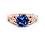 Rose gold Round Cut Blue Sapphire Solitaire Engagement Ring with Celtic Knot Band and Four-Prong Setting