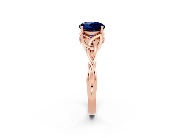 Rose gold Round Cut Blue Sapphire Solitaire Engagement Ring with Celtic Knot Band and Four-Prong Setting