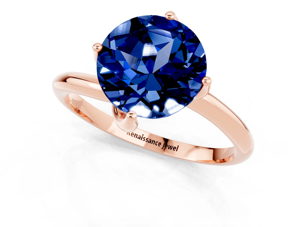 Rose gold Round Cut Blue Sapphire Solitaire Engagement Ring with Four-Prong Setting and Classic Band