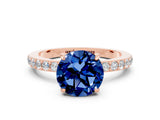 Rose gold Round Cut Blue Sapphire Solitaire Engagement Ring with Pavé Band and Four-Prong Setting