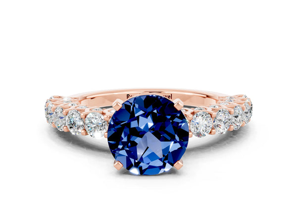 Rose gold Round Cut Blue Sapphire Solitaire Ring with Shared Prong Pavé Band and Four-Prong Setting