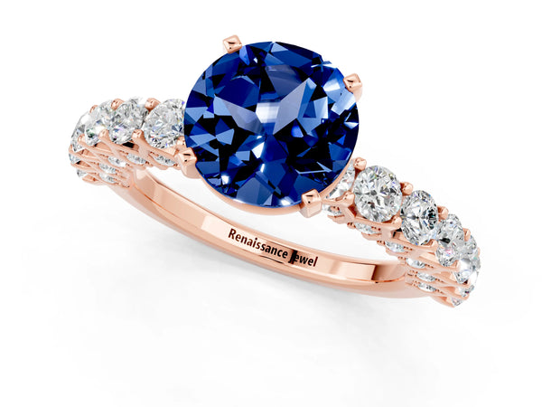 Rose gold Round Cut Blue Sapphire Solitaire Ring with Shared Prong Pavé Band and Four-Prong Setting