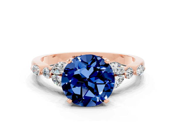 Rose gold Round Cut Blue Sapphire Solitaire Ring with Side Stones and Four-Prong Setting