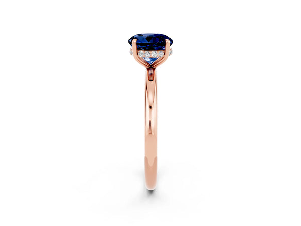 Rose gold Round Cut Blue Sapphire Solitaire Ring with Thin Band and Four-Prong Setting