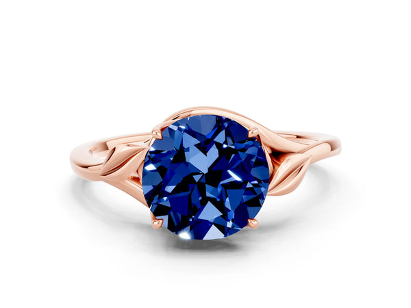 Rose gold Round Cut Blue Sapphire Solitaire Ring with Twist Band and Four-Prong Setting