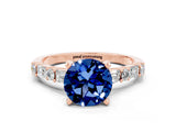 Rose gold Round Cut Blue Sapphire Solitaire with Side Baguettes and Channel Set Band