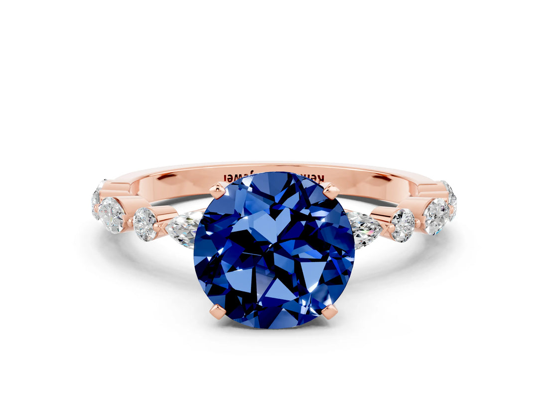 Rose gold Round Cut Blue Sapphire Solitaire with Side Stones on a Pavé Band and Four-Prong Setting