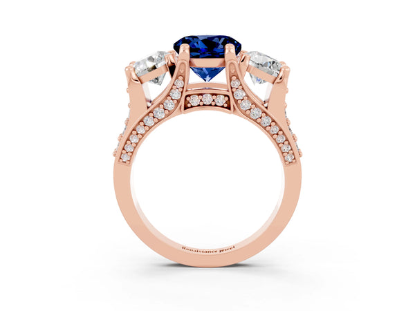 Rose gold Round Cut Blue Sapphire Three-Stone Ring with Channel Set Band and Four-Prong Setting