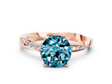 Rose gold Round Cut Blue Topaz Engagement Ring with Side Stone Accents and Four-Prong Setting_60