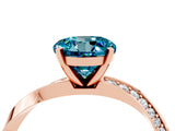 Rose gold Round Cut Blue Topaz Engagement Ring with Side Stone Accents and Four-Prong Setting_64
