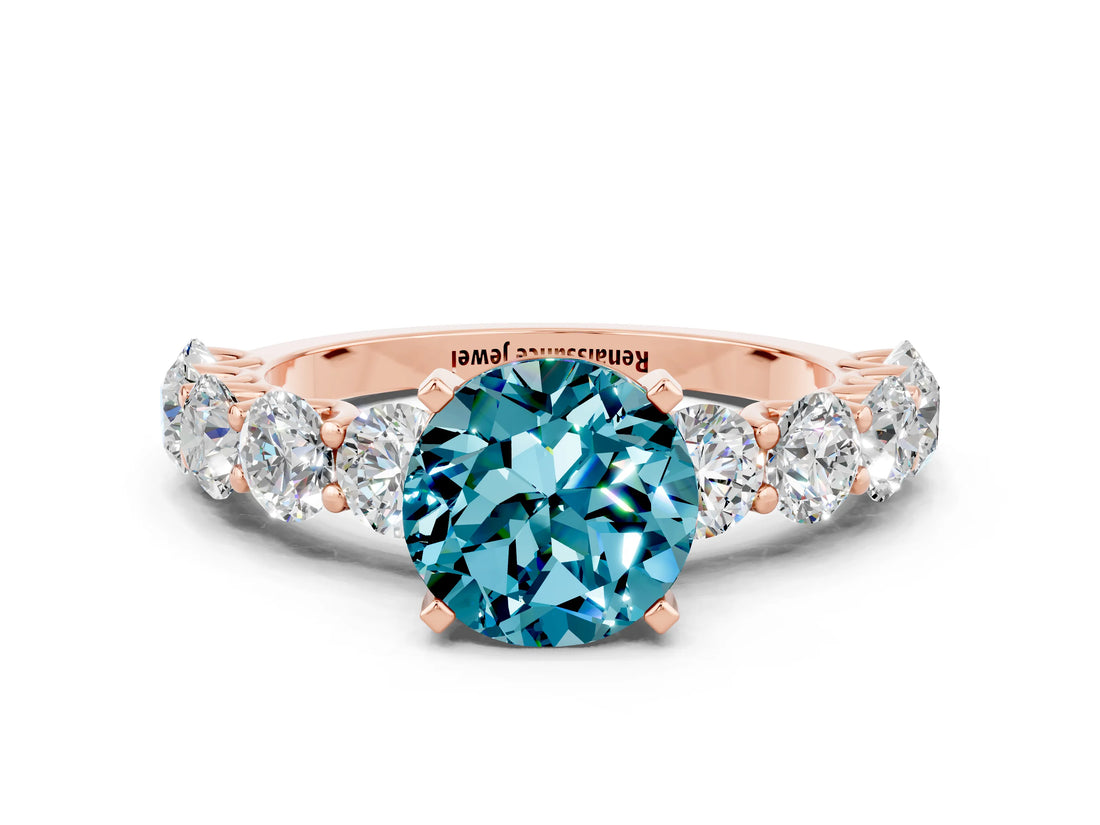 Rose gold Round Cut Blue Topaz Prong Setting with Side Stones on a Pave Band