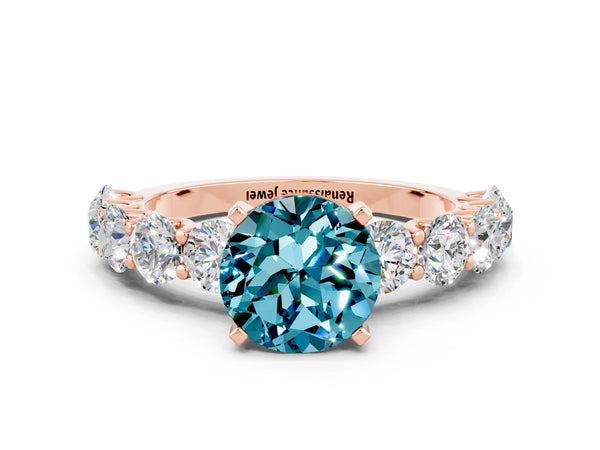 Rose gold Round Cut Blue Topaz Prong Setting with Side Stones on a Pave Band