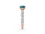 Rose gold Round Cut Blue Topaz Prong Setting with Side Stones on a Pave Band_2