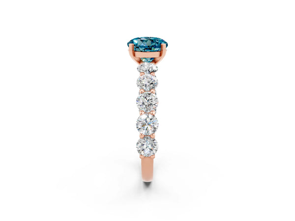 Rose gold Round Cut Blue Topaz Prong Setting with Side Stones on a Pave Band