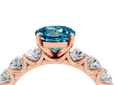 Rose gold Round Cut Blue Topaz Prong Setting with Side Stones on a Pave Band_4