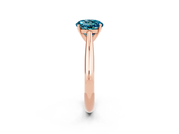 Rose gold Round Cut Blue Topaz Solitaire Engagement Ring with Cathedral Setting and Four-Prong Mount