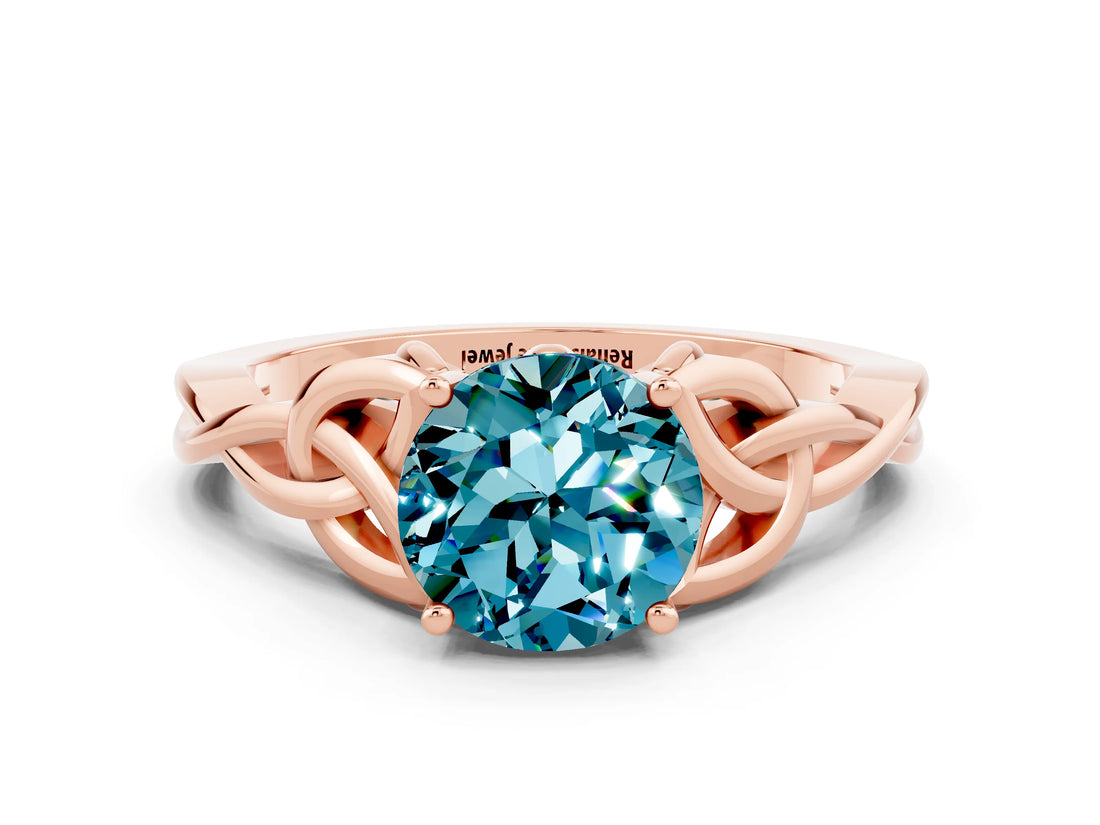 Rose gold Round Cut Blue Topaz Solitaire Engagement Ring with Celtic Knot Band and Four-Prong Setting