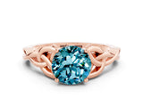 Rose gold Round Cut Blue Topaz Solitaire Engagement Ring with Celtic Knot Band and Four-Prong Setting