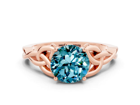 Rose gold Round Cut Blue Topaz Solitaire Engagement Ring with Celtic Knot Band and Four-Prong Setting