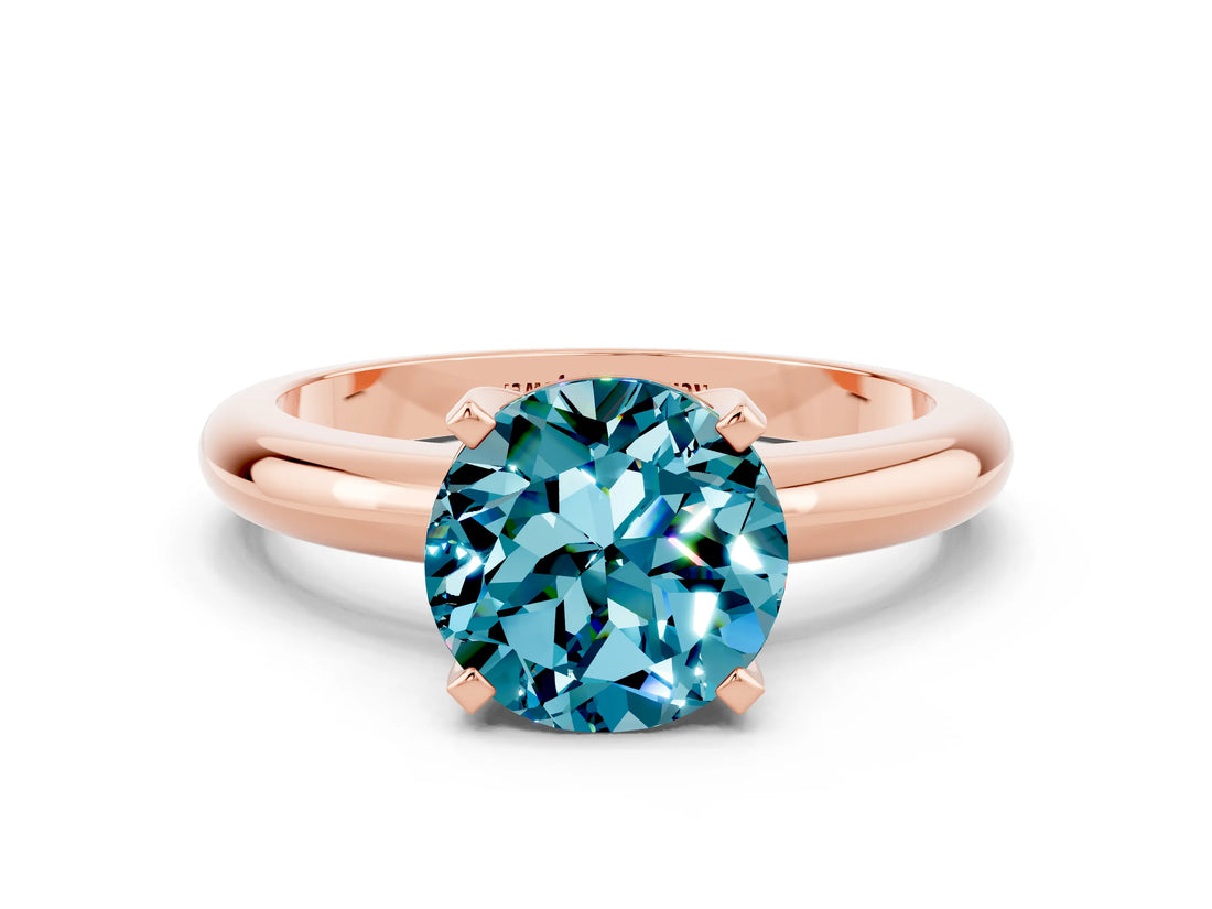 Rose gold Round Cut Blue Topaz Solitaire Engagement Ring with Round Band and Four-Prong Setting