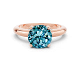 Rose gold Round Cut Blue Topaz Solitaire Engagement Ring with Round Band and Four-Prong Setting
