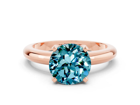 Rose gold Round Cut Blue Topaz Solitaire Engagement Ring with Round Band and Four-Prong Setting