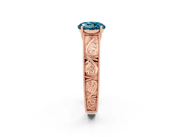 Rose gold Round Cut Blue Topaz Solitaire Ring with Engraved Band and Four-Prong Setting
