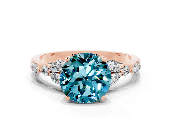 Rose gold Round Cut Blue Topaz Solitaire Ring with Side Stones and Four-Prong Setting