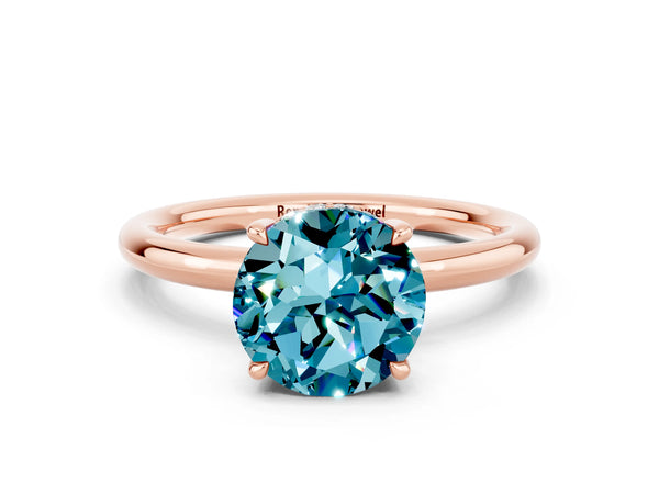 Rose gold Round Cut Blue Topaz Solitaire Ring with Thin Band and Four-Prong Setting