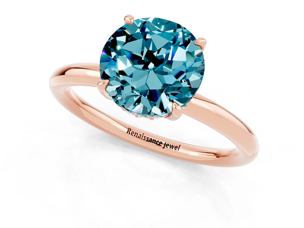 Rose gold Round Cut Blue Topaz Solitaire Ring with Thin Band and Four-Prong Setting