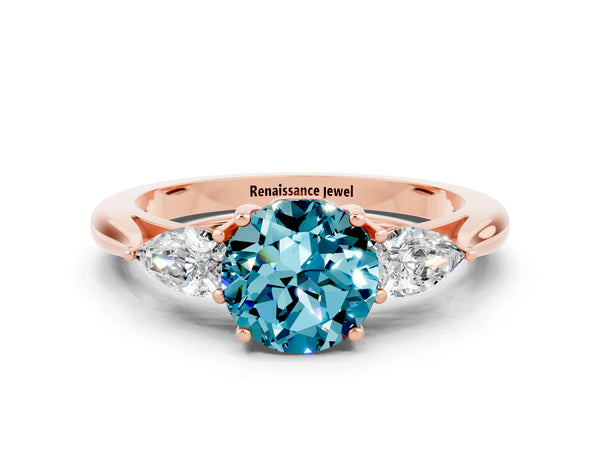 Rose gold Round Cut Blue Topaz Three-Stone Ring with Pear  Side Stones and Prong Setting
