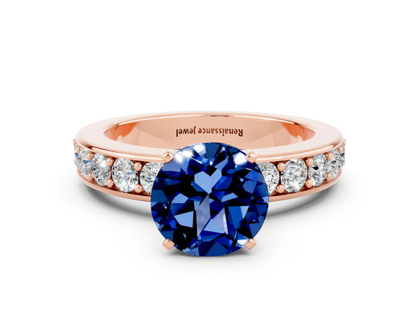 Rose gold Round Cut Blue Sapphire Engagement Ring with Channel Set Round Band and Prong Setting