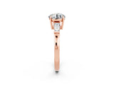 Rose gold Round Cut Cut Diamond Ring with Tapered Baguette Side Stones in Four-Prong Setting_2