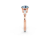 Rose gold Round Cut Cut Diamond Ring with Tapered Baguette Side Stones in Four-Prong Setting_2