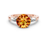 Rose gold Round Cut Cut Diamond Ring with Tapered Baguette Side Stones in Four-Prong Setting