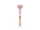 Rose gold Round Cut Diamond Ring with Baguette Side Stones, Channel Set Band, and Four-Prong Setting_39
