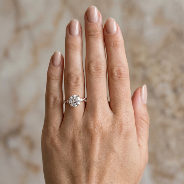 Rose gold Round Cut Diamond Ring with Marquise Side Stones and Prong Setting