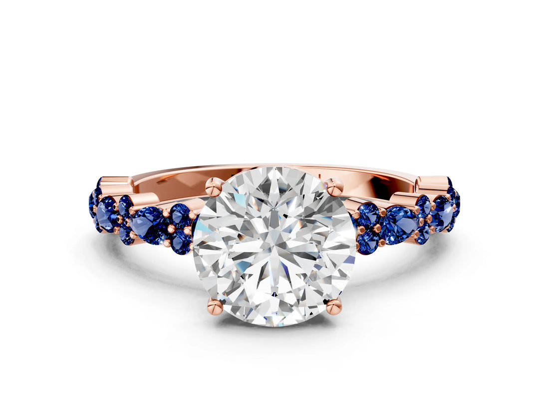 Rose gold Round Cut Diamond Side Stone Solitaire Ring with Round with Blue Sapphire side stone and Four-Prong Setting