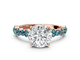 Rose gold Round Cut Diamond Side Stone Solitaire Ring with Round with Blue Topaz side stone and Four-Prong Setting